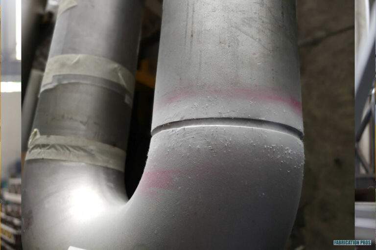 Close-up of a welded steel pipe elbow