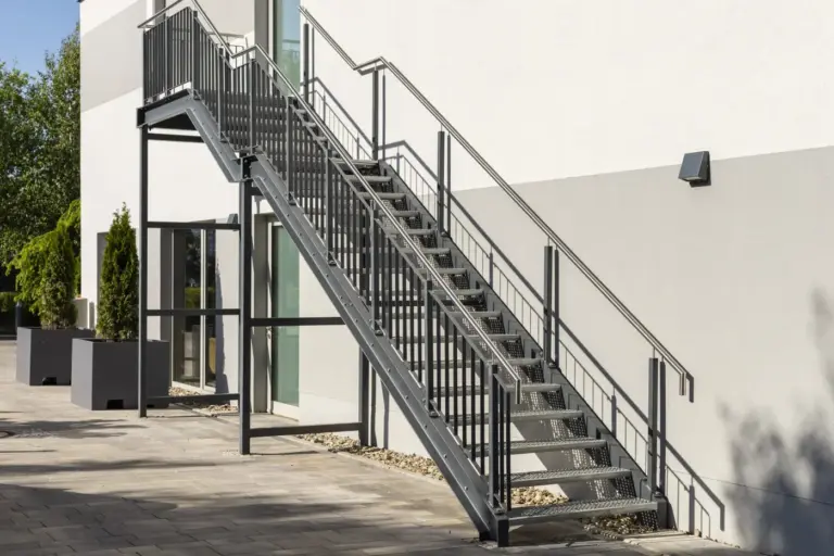 Exterior steel staircase with handrails on a commercial building